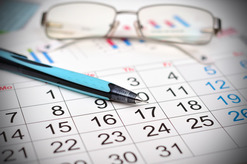Glasses and Pen on Calendar